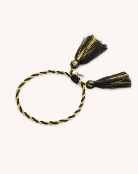 Bracelet en tissu ajustable cordon à pompons de la marque MYA BAY disponible chez Joy et Lea Douai